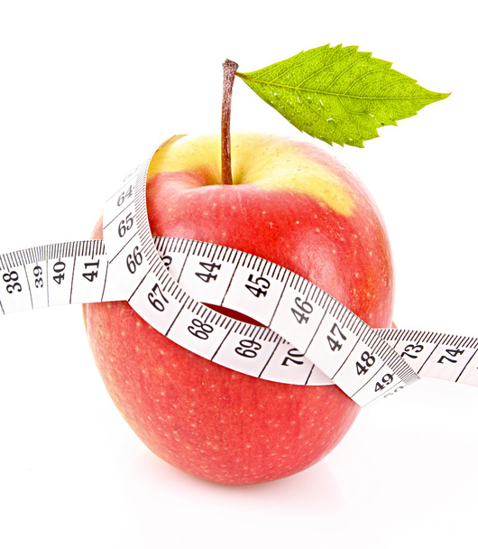 Apple with green leaf and a measure tape, diet concept - Φωτογραφία, εικόνα