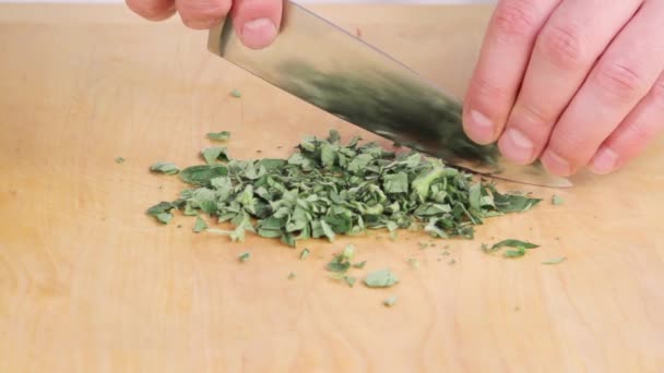 Chopping oregano leaves - Footage, Video