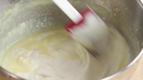 Folding whipped cream into creme - Footage, Video