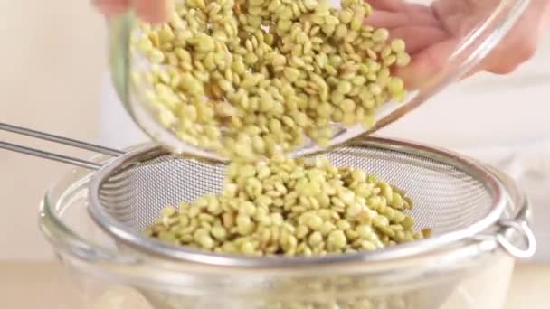 Draining lentils with a colander - Footage, Video