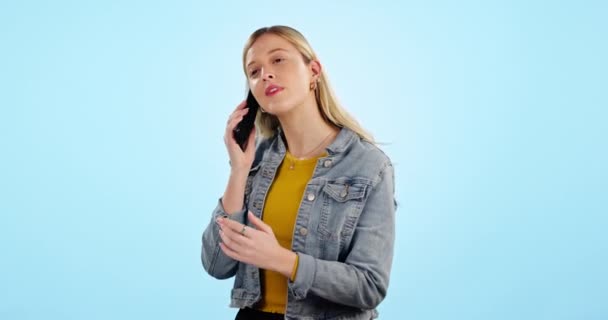 Smile, phone call and woman with connection, speaking and communication on a blue studio background. Person, happy girl and model with a smartphone, network and digital app with discussion or talking. - Footage, Video