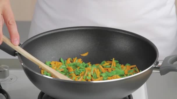 Chef frying carrots - Footage, Video