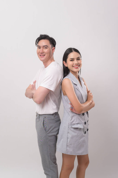 Young Asian couple smiling over white background - Photo, image
