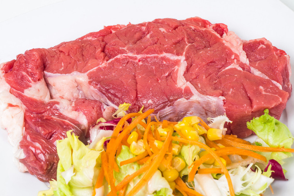 Raw veal and salad - Photo, Image