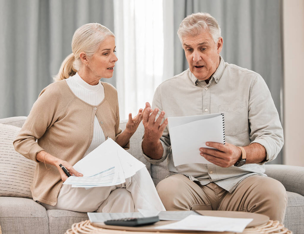 Stress, old couple with documents and taxes in home, mortgage payment and retirement funding crisis. Financial budget, senior man and woman on sofa with anxiety for bills, life insurance and debt - Photo, Image