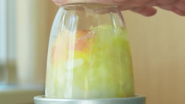 Making fruit juice using electric blender. - Footage, Video