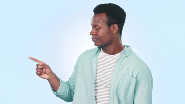Hand, thumbs down and face of black man with review, feedback or disagreement vote on blue background in studio, Negative, opinion and gesture with hand to mockup space with mistake, fail or info. - Footage, Video