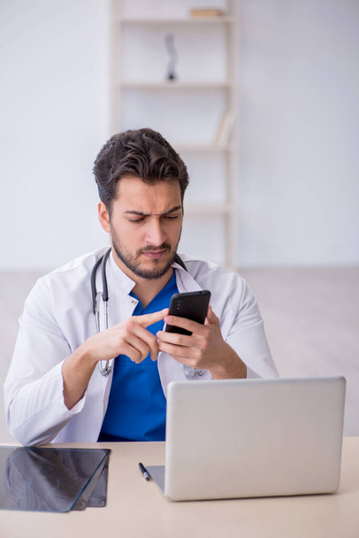 Young doctor in telemedicine concept - Photo, image
