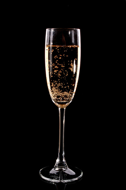 Glass with champagne on black background - Foto, Imagem