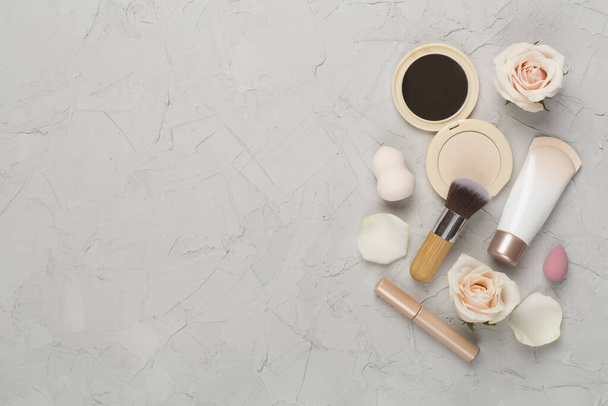 Composition with makeup products for skin tone on concrete background, top view - Photo, Image
