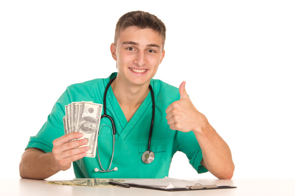 Young doctor with money - Фото, зображення