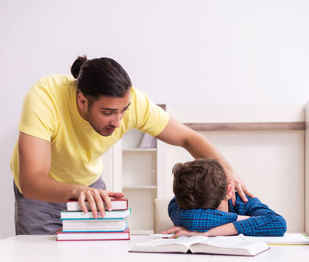 The father helping his son to prepare for school - Photo, Image