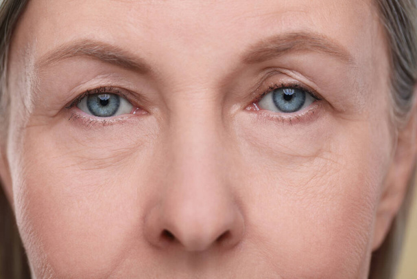 Closeup view of senior woman's face with aging skin - Photo, Image