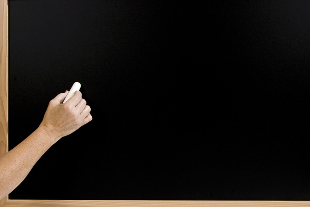 Hand Ready to Write On Blank Chalkboard - Фото, изображение