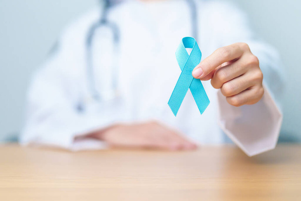 Blue November Prostate Cancer Awareness month, Doctor with Blue Ribbon in hospital for support people life and illness. Healthcare, International men, Father, Diabetes and World cancer day - Photo, Image