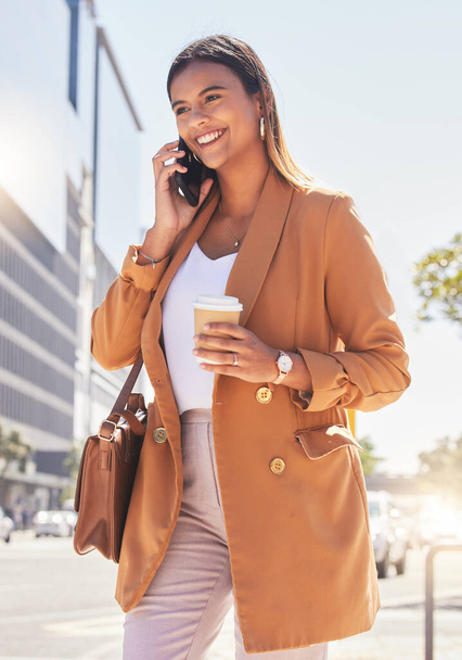 Phone call, coffee and business woman in city for journey, morning commute and travel for work. Networking, corporate worker and person walking on smartphone for communication, connection and contact. - Foto, immagini