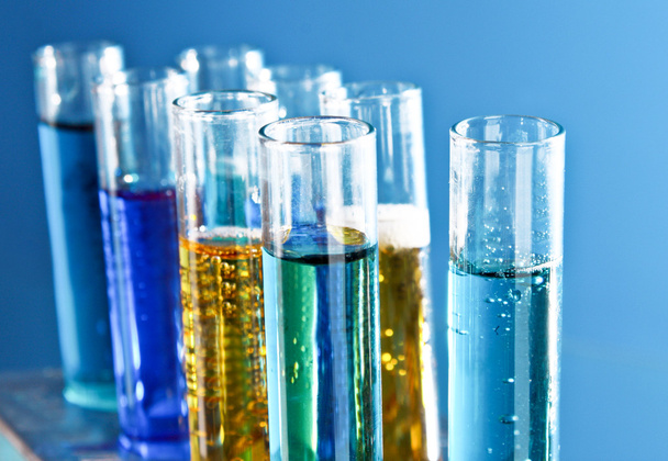 Test tubes on blue background - Photo, image