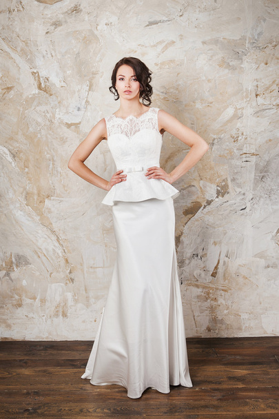 beautiful woman with long hair wearing luxurious wedding dress - Fotografie, Obrázek