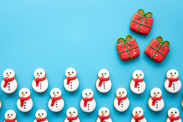 Christmas background with handmade gingerbread covered with icing, flat lay. - Foto, imagen