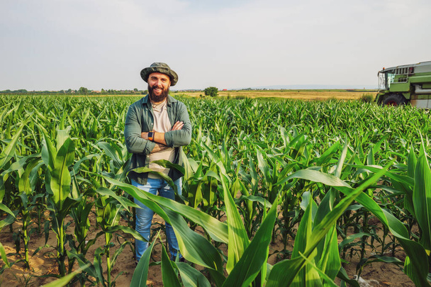 Portrait of farmer who is cultivating corn. Agricultural occupation. - Photo, Image