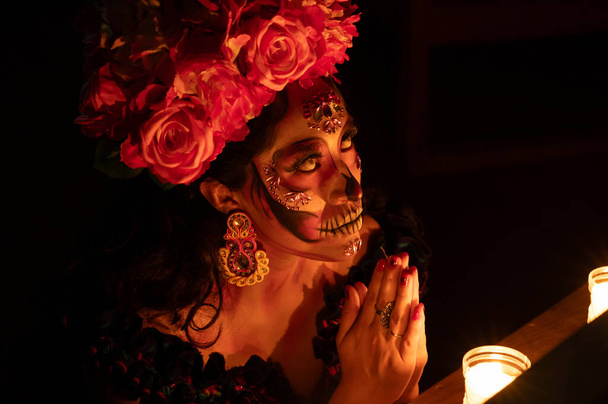 Calavera Catrina sitting on a throne. Sugar skull makeup. Dia de los muertos. Day of The Dead. Halloween. - Photo, Image