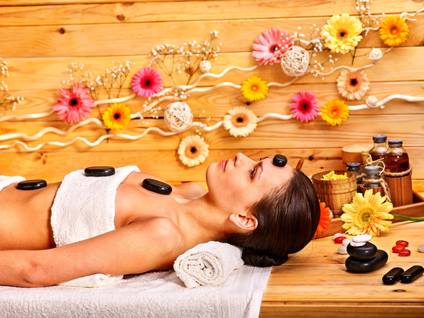 Woman getting stone therapy massage . - Photo, Image