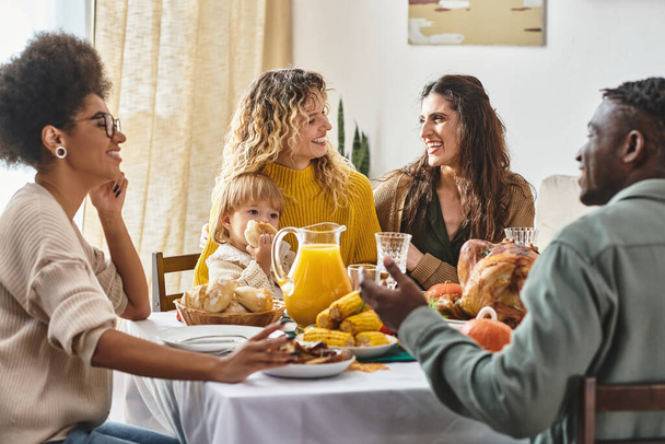 happy african american couple talking and laughing near lgbt family on Thanksgiving day, diversity - Zdjęcie, obraz
