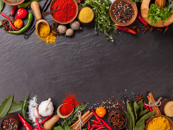 Various spices on black stone - Photo, Image