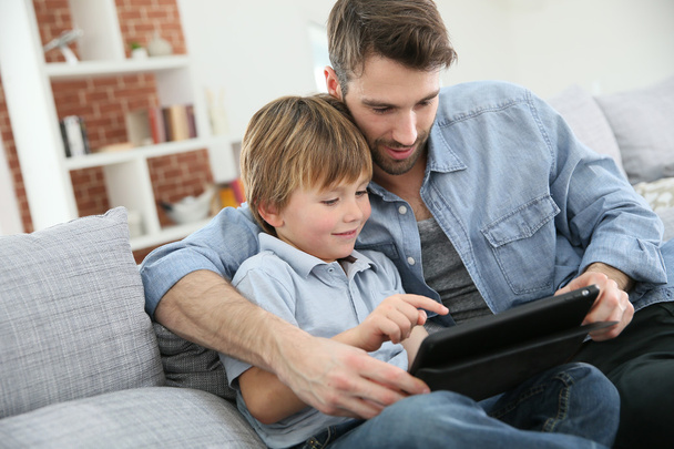 Father with boy using tablet - Fotó, kép