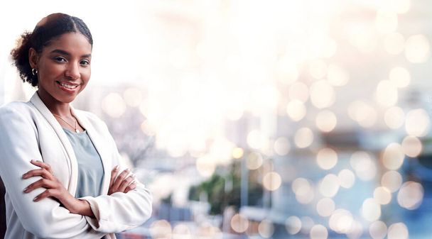Black woman, arms crossed and city portrait with a smile from business consultant work with mockup space. Confidence, female entrepreneur and professional from New York happy on urban road with bokeh. - 写真・画像