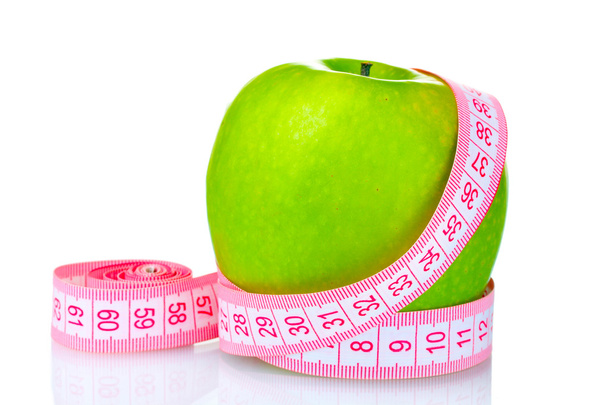 Green apple and measuring tape isolated on white - Foto, afbeelding