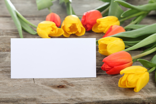 Bouquet of tulips and greeting card - 写真・画像