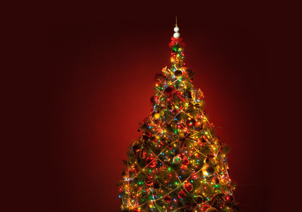 Art Christmas tree on red background - Fotó, kép