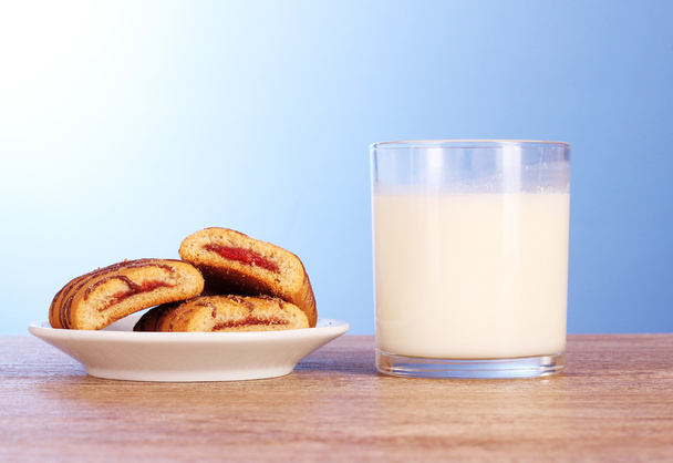 Cookies with milk on blue background - Photo, image