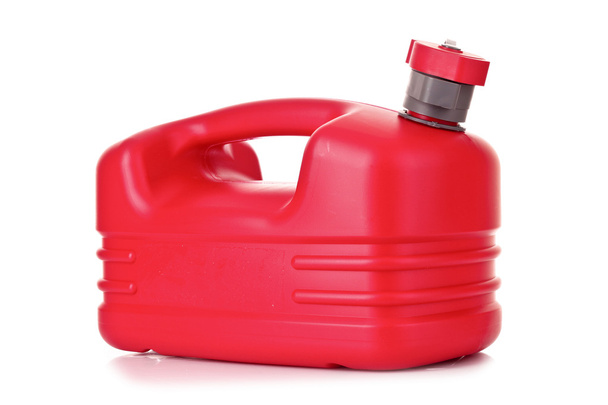 Red plastic fuel canister in hand isolated on white - Fotoğraf, Görsel