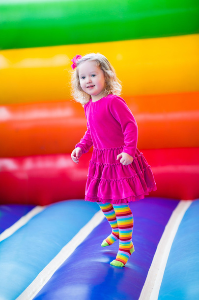 Little girl jumping and bouncing  - Photo, Image