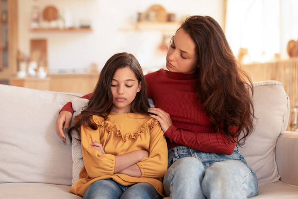 Kid Mental Problem. Loving Mom Talking And Embracing Unhappy Daughter, Supporting Child In Preteen Struggles And Depression, Sitting Together On Couch In Living Room At Home - Photo, Image