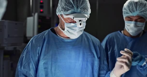 Surgery, team of doctors and tools in operation theater, hospital or clinic. Surgeon group, medical nurse and equipment in emergency room for healthcare, treatment and people working to help in ICU. - Footage, Video