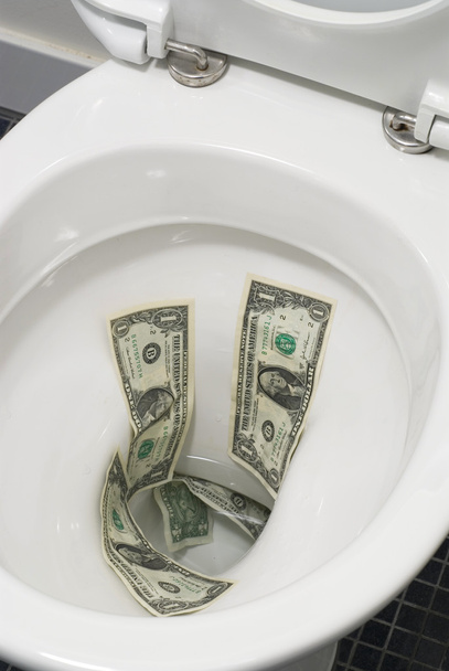 Dollar bills flushed down the toilet - Foto, Bild