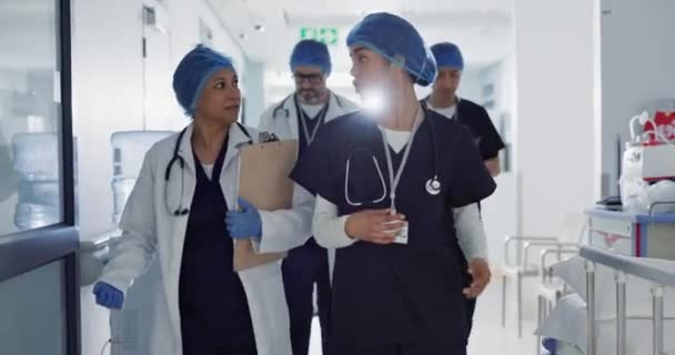 Doctors, nurses and people walking, teamwork or planning healthcare, clinic management and talking of ideas. Medical worker, surgeon and mentor support, hospital feedback and checklist or charts. - Footage, Video
