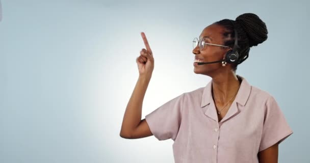 Call center, studio and happy black woman point at telemarketing chart, customer care information or help desk timeline. Checklist, mockup space portrait and African bank advisor on blue background. - Footage, Video