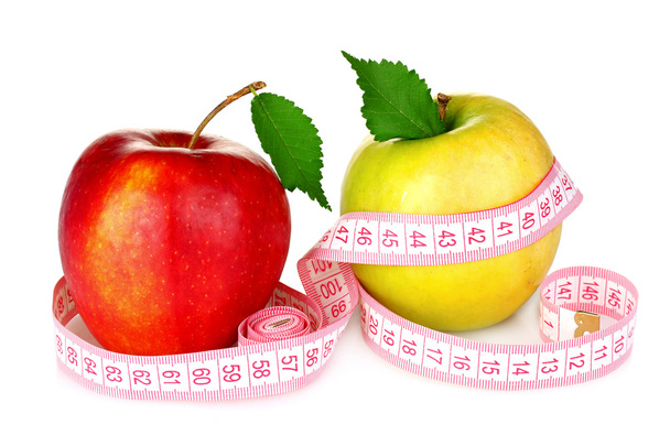 Apple and measuring tape - Foto, afbeelding