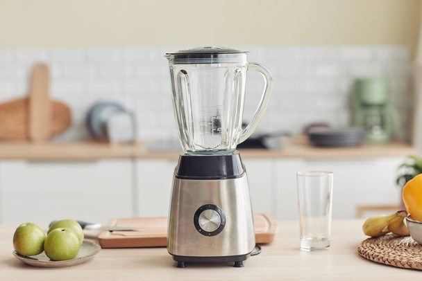 Background image of chrome blender on kitchen counter with fruits, copy space - Photo, Image