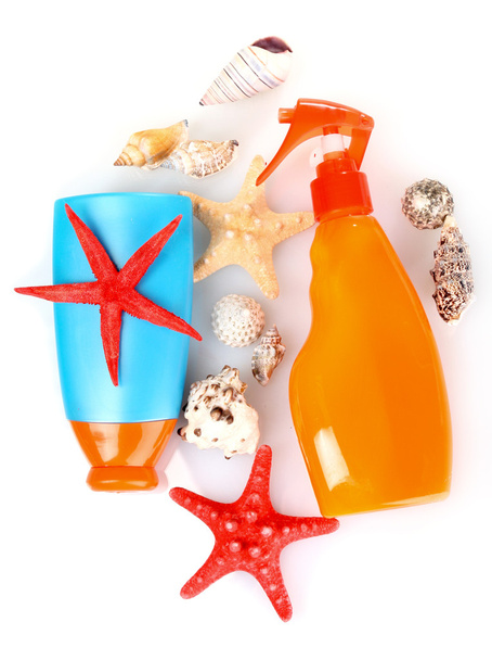 Sunblock in bottles and shells isolated on white - Photo, image