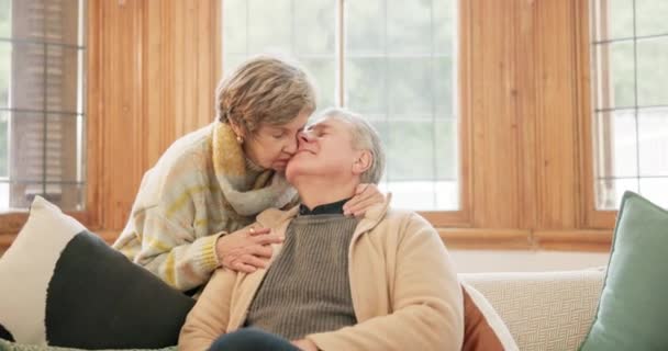 Home, hug and senior couple with marriage, kiss and commitment with retirement, support and kindness. Happiness, elderly woman and old man embrace, romance, trust and bonding with care, calm and love. - Кадри, відео