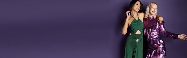 Happy New Year, joyful interracial friends in festive attire smiling on purple backdrop, banner - Foto, Imagem
