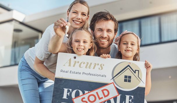 Family, portrait and children with keys for real estate success, new home and moving in neighborhood. Mother, father and girl kids with sold board or sign for property investment and outdoor house. - Photo, Image