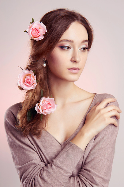 Young woman with flowers in hairs - Foto, Imagem