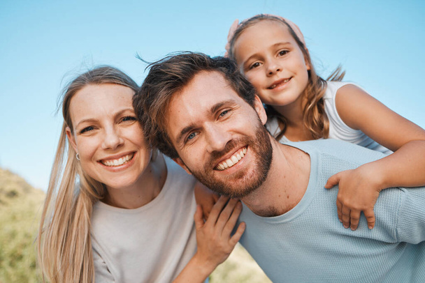 Nature portrait, happiness and family child, mother and father enjoy time together, park or outdoor wellness. Freedom, summer holiday and face of happy mom, dad and young kid bonding, care and love. - Photo, Image