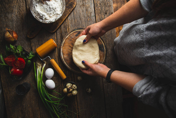 Girl preparing dough in the kitchen - Photo, Image